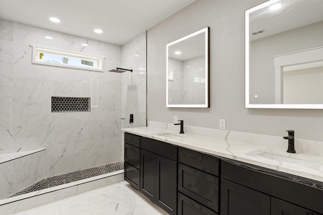 bathroom featuring vanity and a tile shower