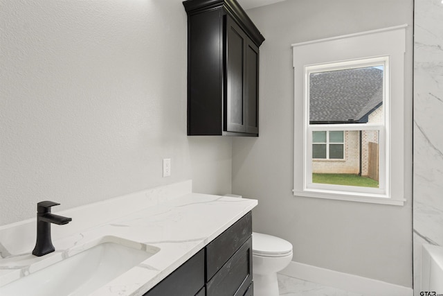 bathroom with toilet, walk in shower, and vanity