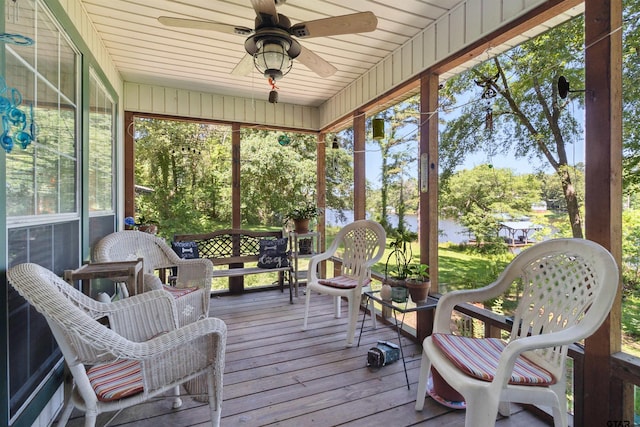 sunroom with wooden ceiling and ceiling fan