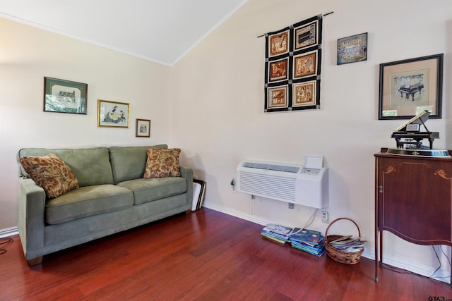 interior space with vaulted ceiling, ornamental molding, dark hardwood / wood-style flooring, and a wall mounted air conditioner