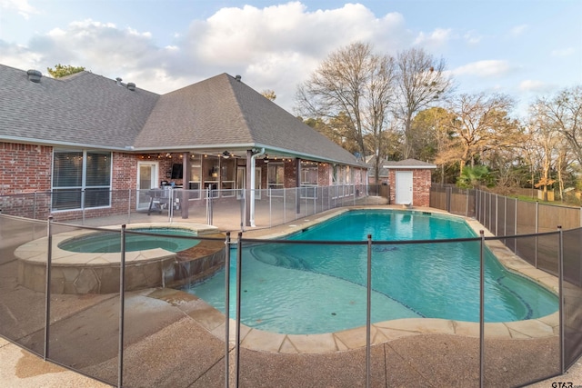 view of pool featuring a patio area and an in ground hot tub