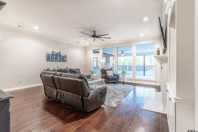 living room featuring ornamental molding, dark hardwood / wood-style floors, and ceiling fan