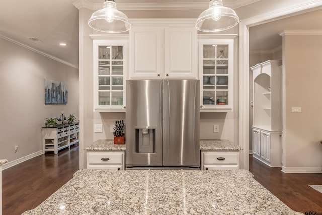 kitchen with white cabinetry, dark wood-type flooring, light stone countertops, and stainless steel fridge with ice dispenser