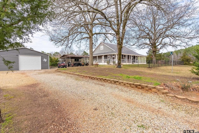 view of front of home featuring a garage and an outdoor structure