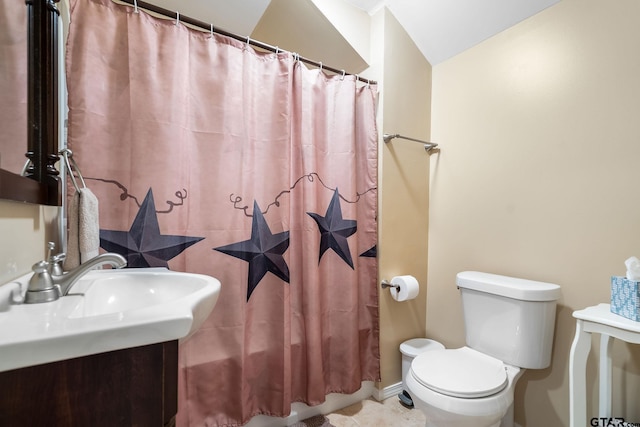 bathroom featuring vanity, a shower with curtain, tile patterned floors, and toilet