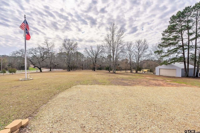 view of yard featuring a garage