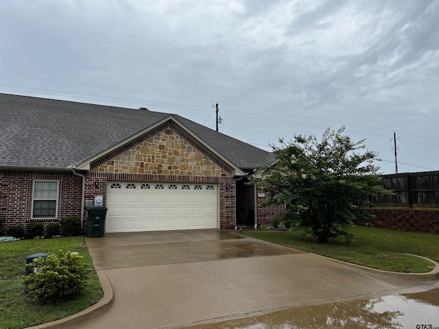 112 Letha Ct, Tyler, TX 75702 - view of front of property with a garage, a shingled roof, concrete driveway, and brick siding