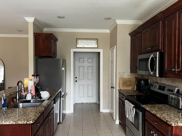 112 Letha Ct, Tyler, TX 75702 - kitchen featuring appliances with stainless steel finishes, light tile patterned floors, a peninsula, stone counters, and ornamental molding