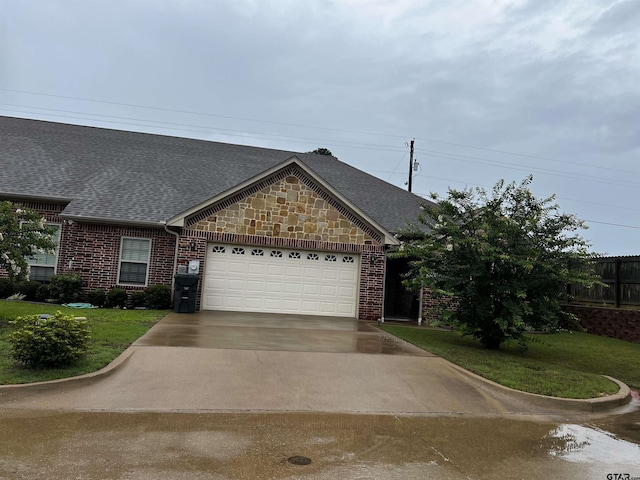 112 Letha Ct, Tyler, TX 75702 - view of front of home featuring an attached garage, a shingled roof, concrete driveway, and brick siding