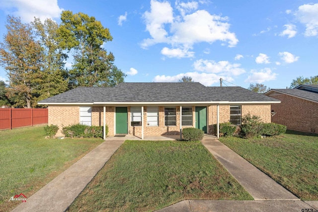 single story home with a front yard