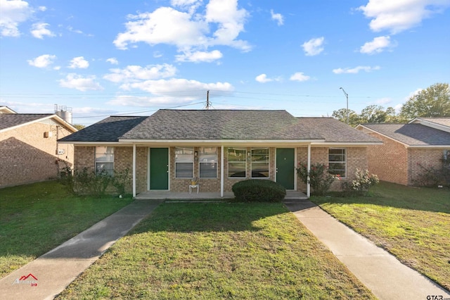 ranch-style home featuring a front yard