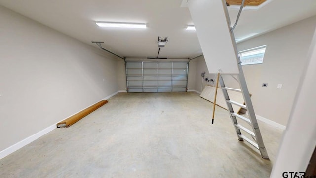 19346 Aida Dr, Flint, TX 75762 - garage with a garage door opener and baseboards