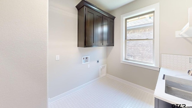19346 Aida Dr, Flint, TX 75762 - laundry area with electric dryer hookup, cabinet space, hookup for a washing machine, and light floors