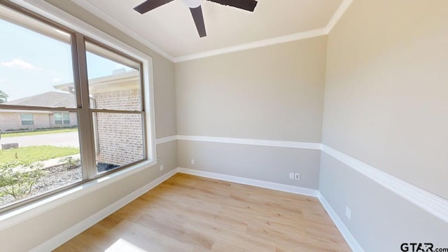 19346 Aida Dr, Flint, TX 75762 - empty room with healthy amount of natural light, ornamental molding, wood finished floors, and ceiling fan