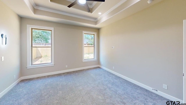 19346 Aida Dr, Flint, TX 75762 - spare room featuring a tray ceiling, ceiling fan, ornamental molding, carpet floors, and a smoke detector