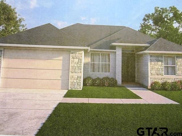 19346 Aida Dr, Flint, TX 75762 - view of front of house with stone siding, an attached garage, concrete driveway, and a front lawn