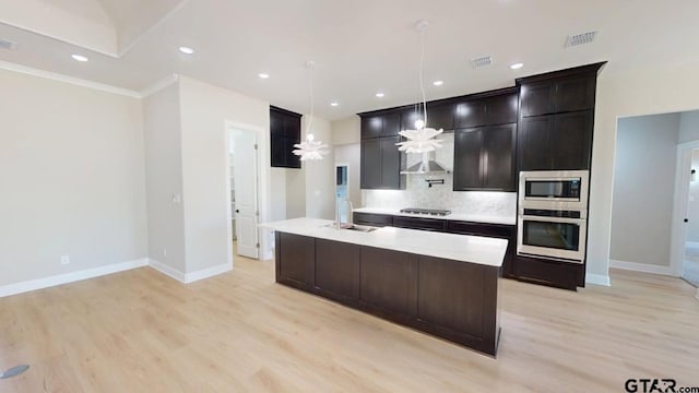 19346 Aida Dr, Flint, TX 75762 - kitchen with stainless steel appliances, light wood-style floors, tasteful backsplash, light countertops, and hanging light fixtures