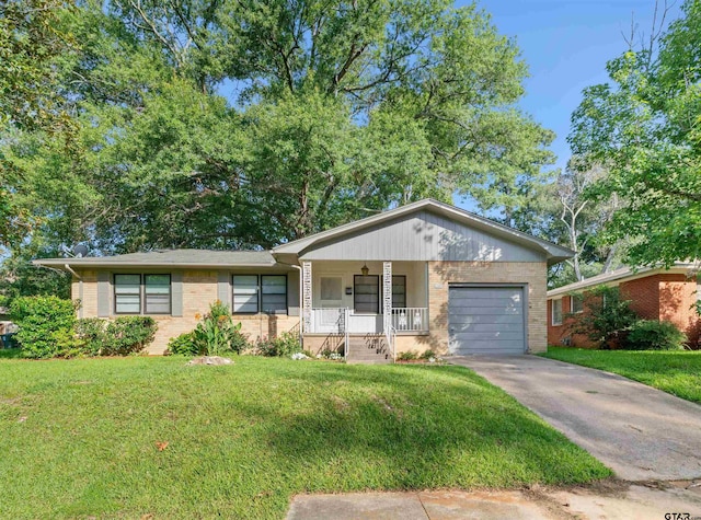 ranch-style house with a garage, a porch, and a front yard