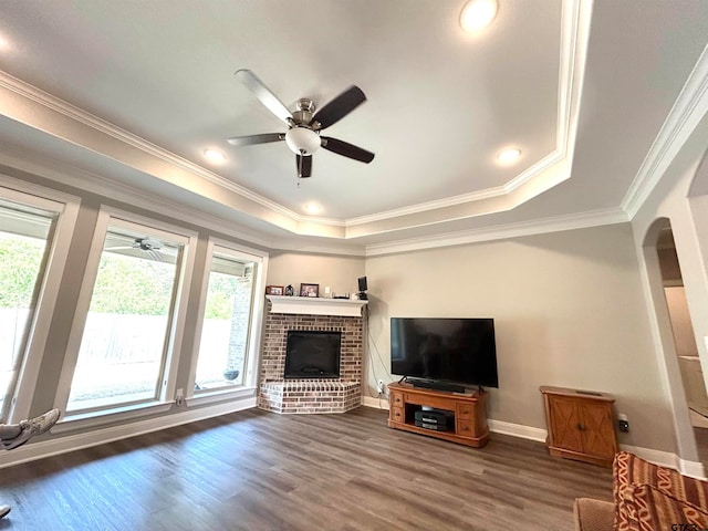 unfurnished living room with dark hardwood / wood-style flooring, a healthy amount of sunlight, and crown molding