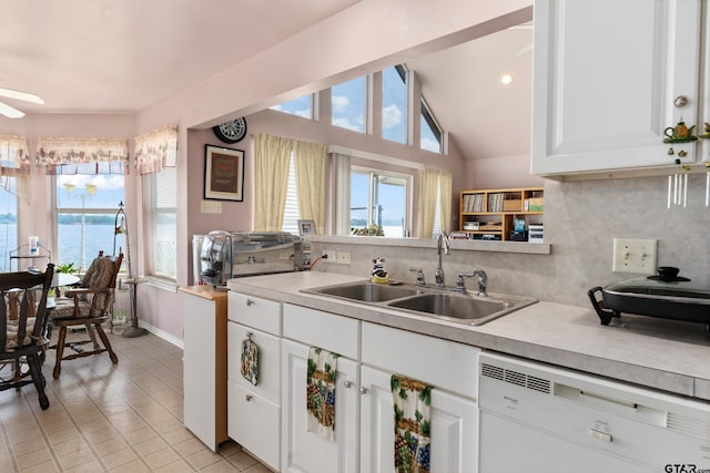 15541 Precidio Cir, Malakoff, TX 75148 - kitchen with dishwasher, backsplash, light countertops, light tile patterned floors, and white cabinetry