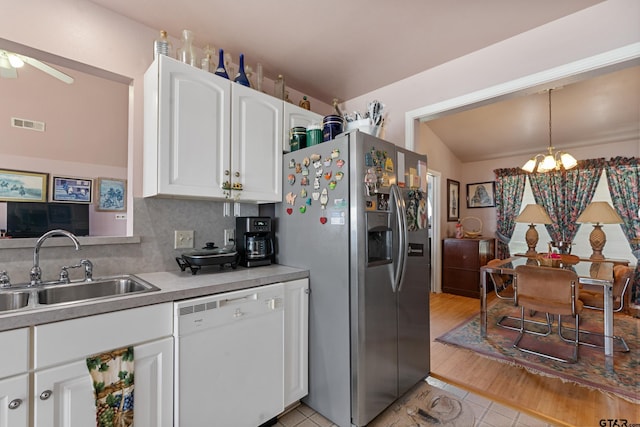 15541 Precidio Cir, Malakoff, TX 75148 - kitchen with white dishwasher, stainless steel fridge with ice dispenser, light tile patterned flooring, white cabinets, and light countertops