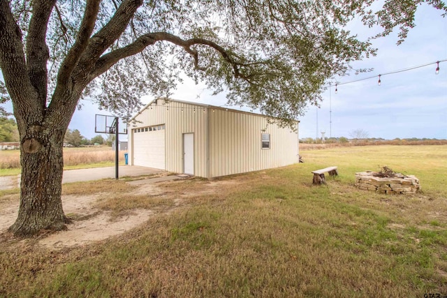 exterior space featuring a garage and an outdoor structure