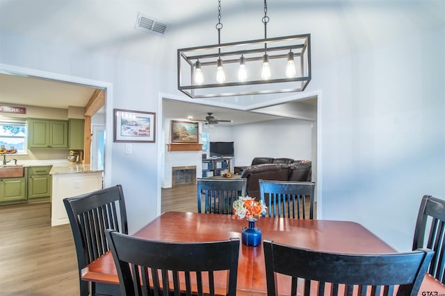 dining room featuring light hardwood / wood-style flooring and ceiling fan