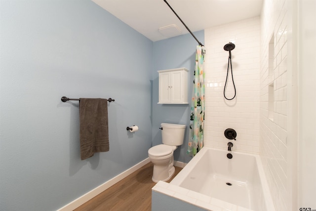 bathroom with shower / bath combo with shower curtain, wood-type flooring, and toilet