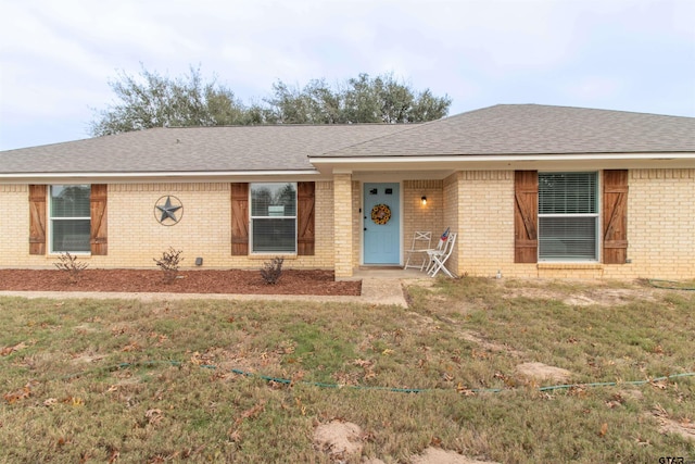 ranch-style house with a front yard