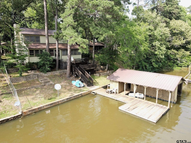 dock area featuring a deck with water view