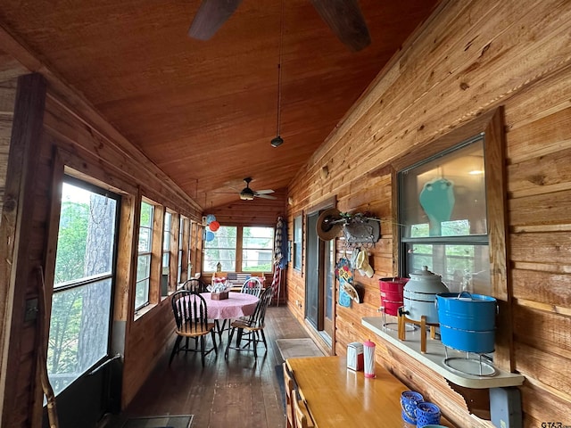 sunroom featuring ceiling fan, wood ceiling, and vaulted ceiling