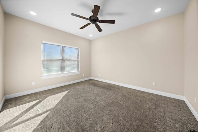 carpeted empty room featuring ceiling fan