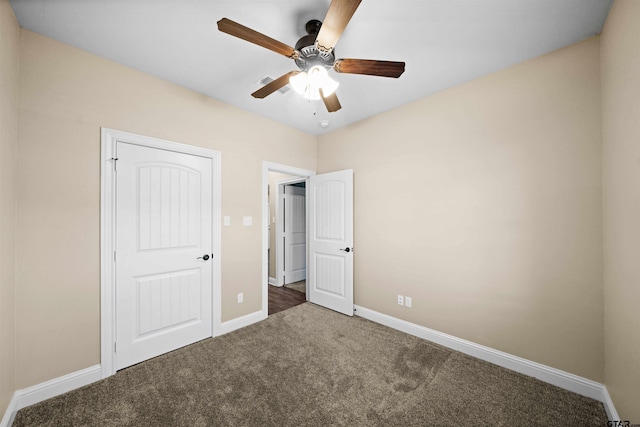 unfurnished bedroom featuring carpet flooring, ceiling fan, and a closet