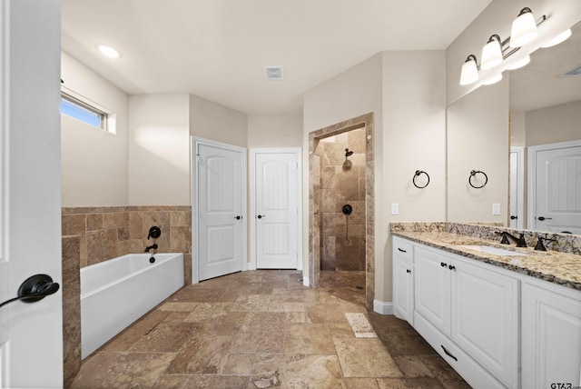 bathroom with shower with separate bathtub and vanity