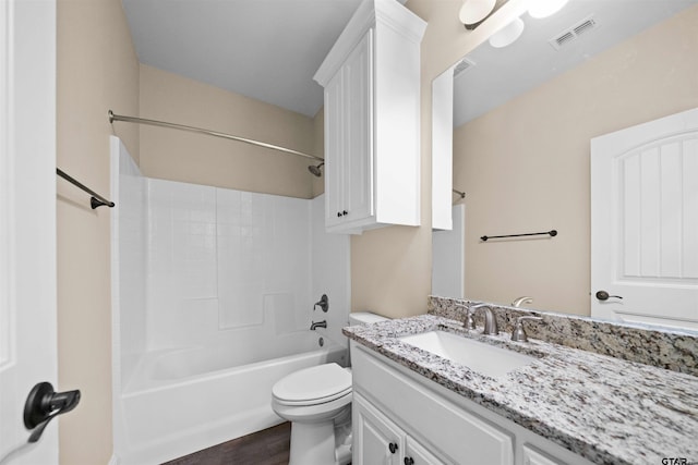 full bathroom featuring vanity, toilet, wood-type flooring, and washtub / shower combination