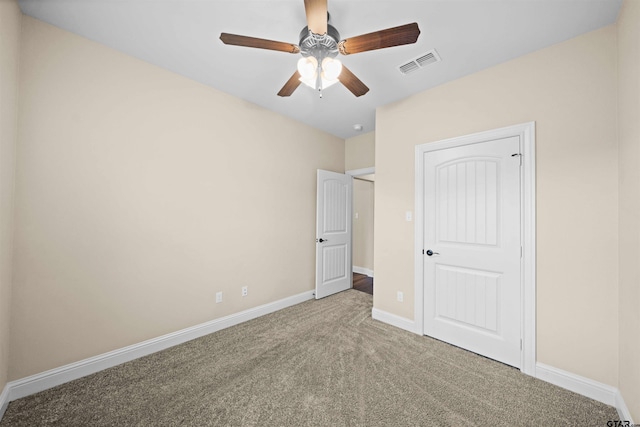 unfurnished bedroom with ceiling fan and carpet