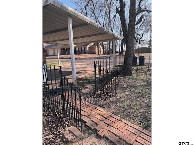 exterior space featuring a carport