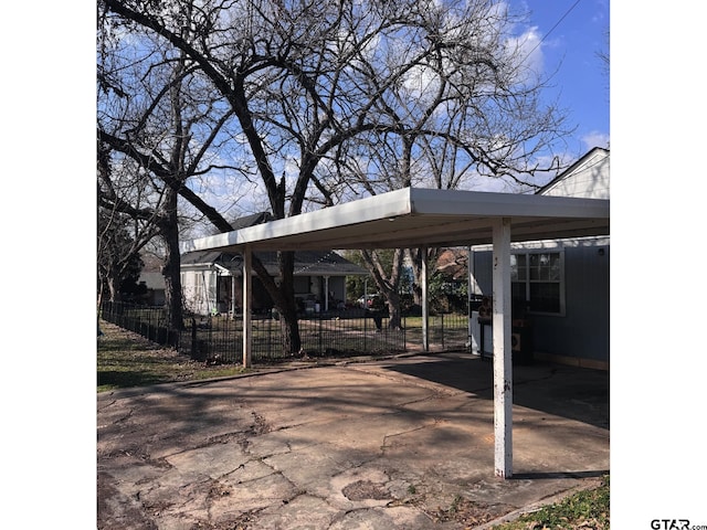 view of vehicle parking with a carport