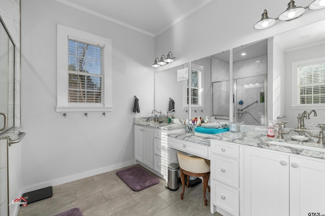 full bathroom with a stall shower, a sink, crown molding, double vanity, and baseboards