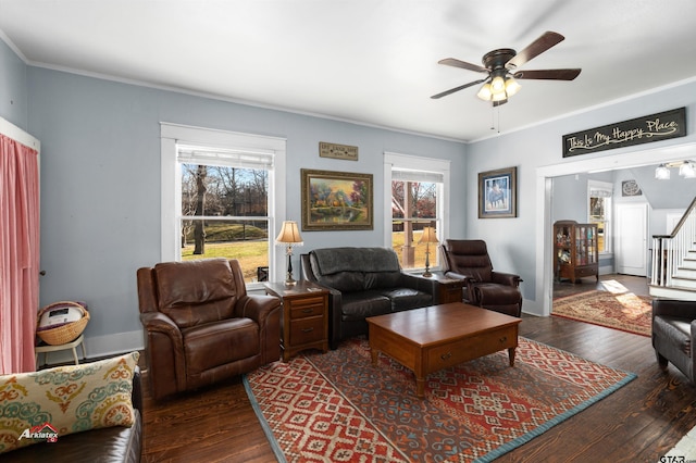 living room featuring a wealth of natural light, stairway, and wood finished floors