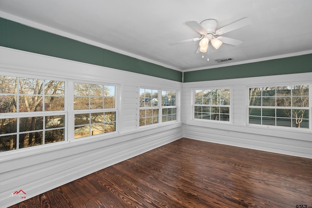 unfurnished sunroom with visible vents and a ceiling fan