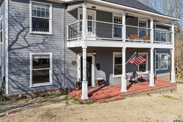 rear view of house featuring ceiling fan