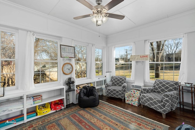 sunroom with a ceiling fan