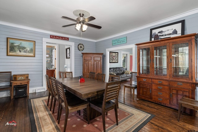 dining space featuring a ceiling fan, dark wood-style floors, and ornamental molding