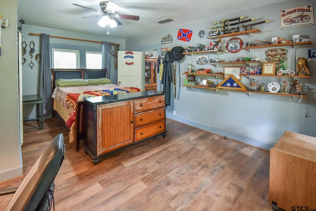 bedroom featuring a closet, hardwood / wood-style flooring, and ceiling fan