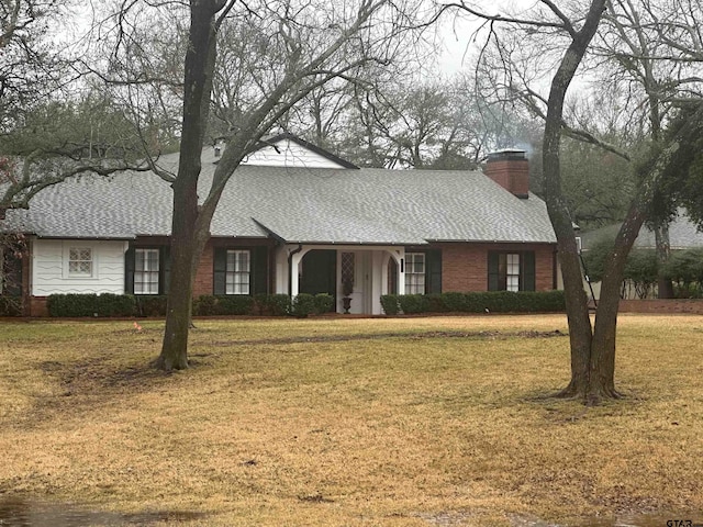 ranch-style house with a front lawn