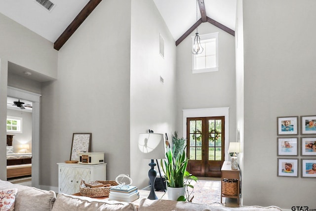 22302 County Road 422, Lindale, TX 75771 - living area featuring high vaulted ceiling, plenty of natural light, beamed ceiling, a ceiling fan, and french doors