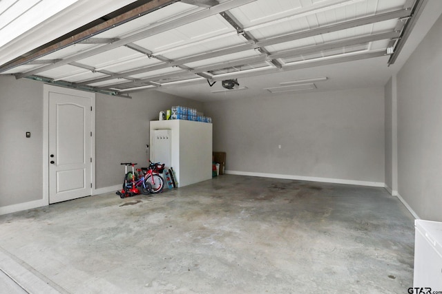 22302 County Road 422, Lindale, TX 75771 - garage with a garage door opener and baseboards