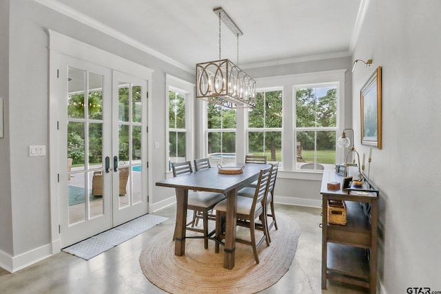22302 County Road 422, Lindale, TX 75771 - dining room with a chandelier, french doors, crown molding, and concrete flooring