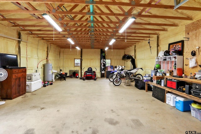 22302 County Road 422, Lindale, TX 75771 - garage featuring electric water heater and a workshop area